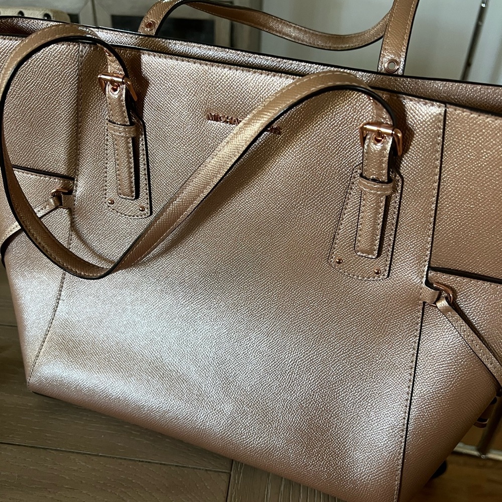 Lightly used Michael Kors Purse - also has padded space for a small laptop